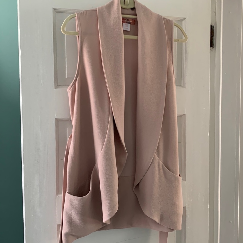 Really cute vest!  Light weight with belt.